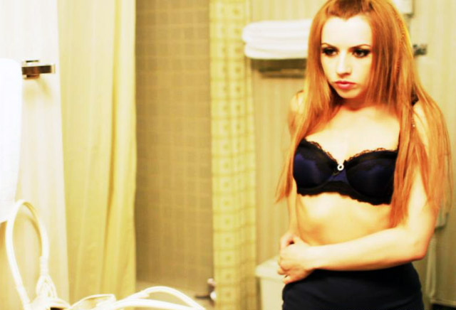 Lexi Belle changing in a hotel room before getting paid for sex.