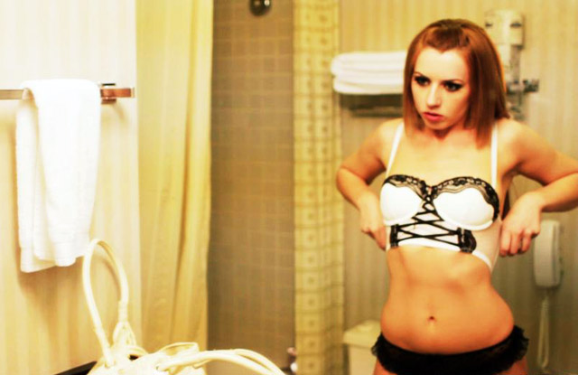 Pornstar Lexi Belle in the mirror changing.