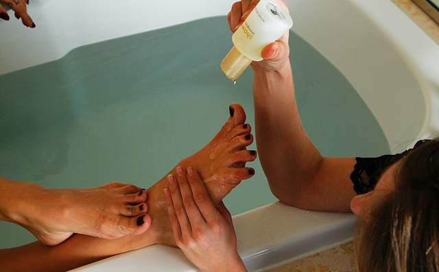 Kayla Jane Danger makes sub Jeanette wash and lick her feet in servitude.