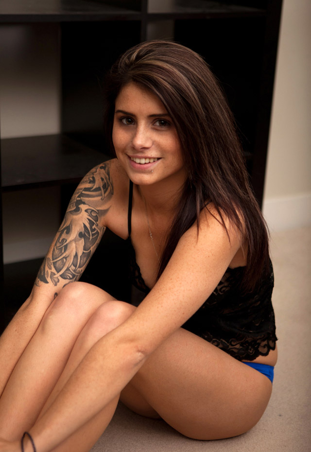 Freckled tattooed Canadian amateur teen Hailey Leigh Davis stripping off her blue panties.