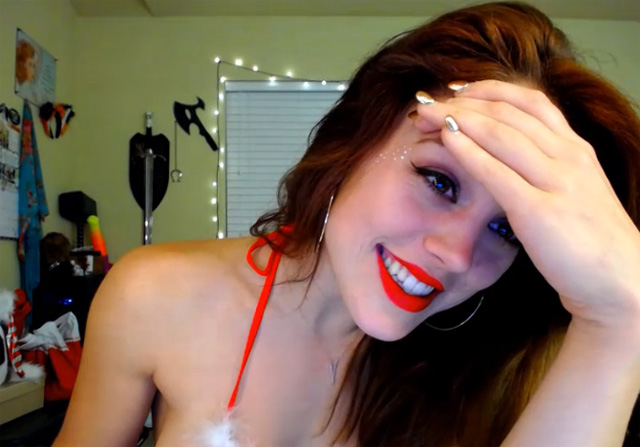 Horny cam girl Molly Christmas webcam babe flashing nice tits in Santa hat.