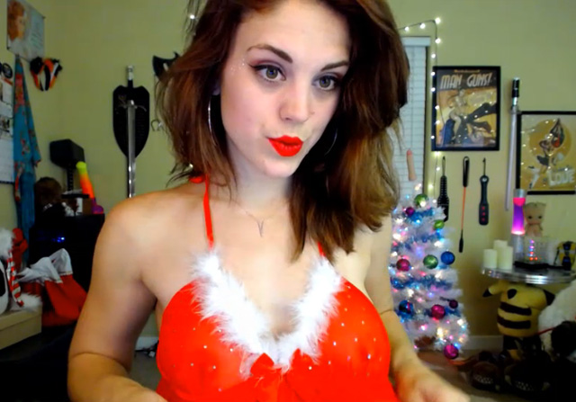 Horny cam girl Molly Christmas webcam babe flashing nice tits in Santa hat.