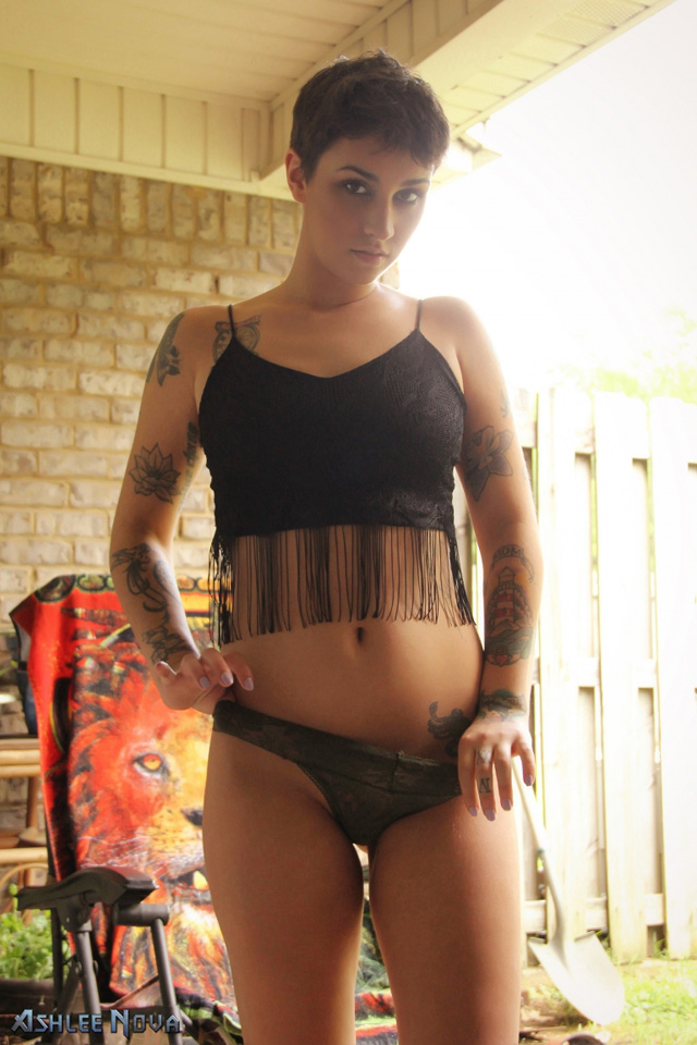 Inked solo hottie Ashlee Nova masturbation zip set orgasming on the patio with toys.